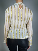 Blusa detalles dorados