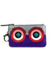 Billetera Purple Monster Eyes Pochette